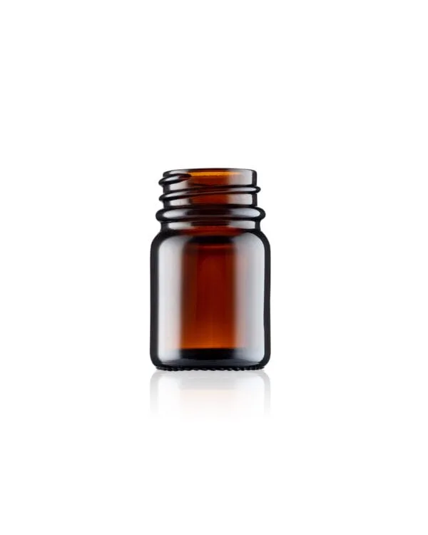 Close up photo of Origin's 15ml amber glass powder jar