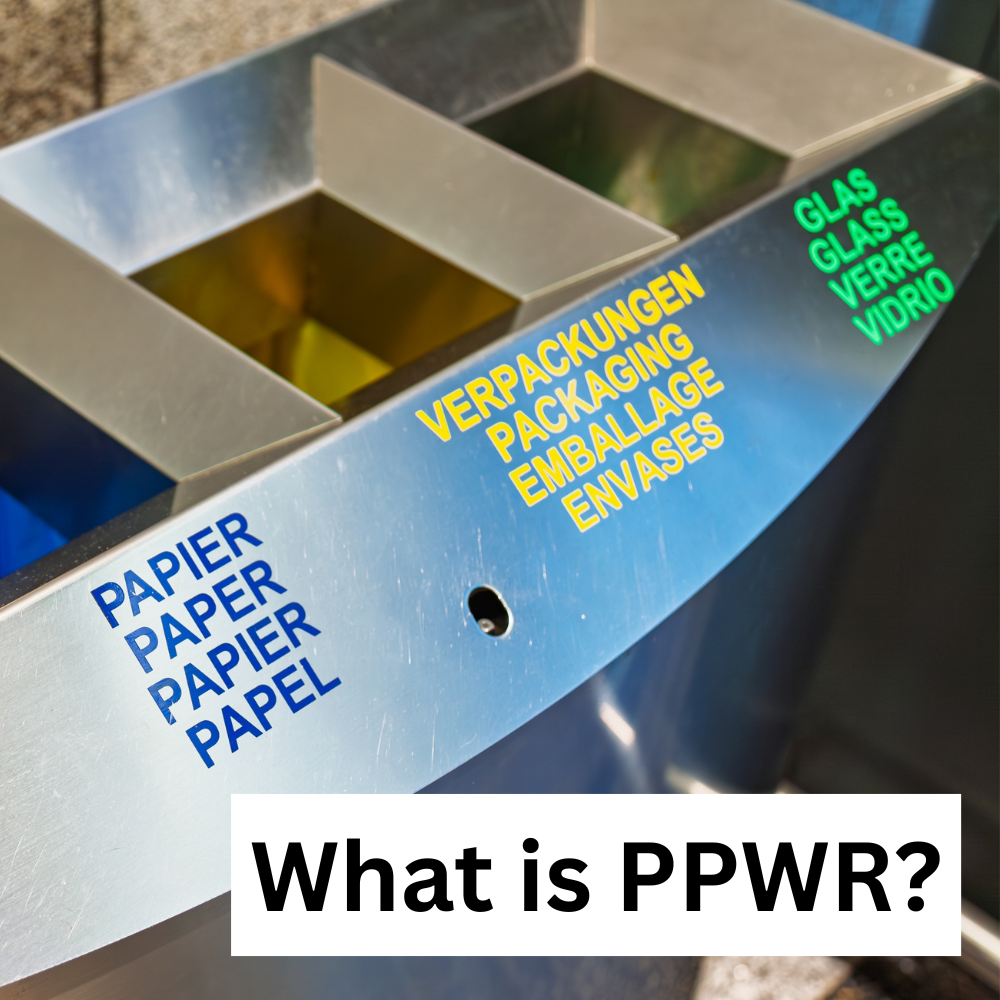 Recycling station with separate waste, paper, packaging and glass compartments, overlaid with the heading “What is PPWR?”